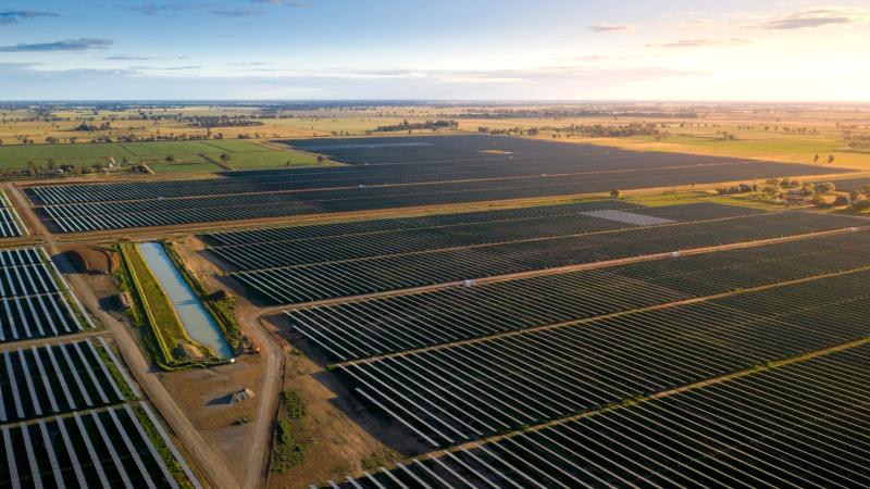 An aerial image of a solar farm at sunrise