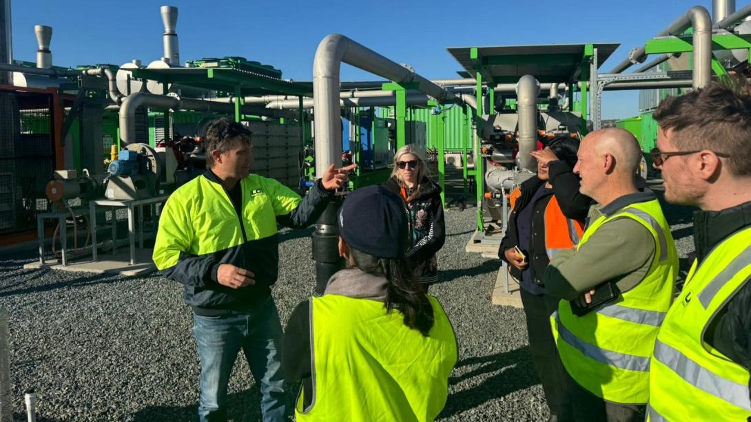 People exploring the gas capture and generator enclosure at Mugga Lane.